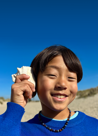 Photo taken with 48MP Fusion camera, next-generation portraits feature in use, focused on a person’s face