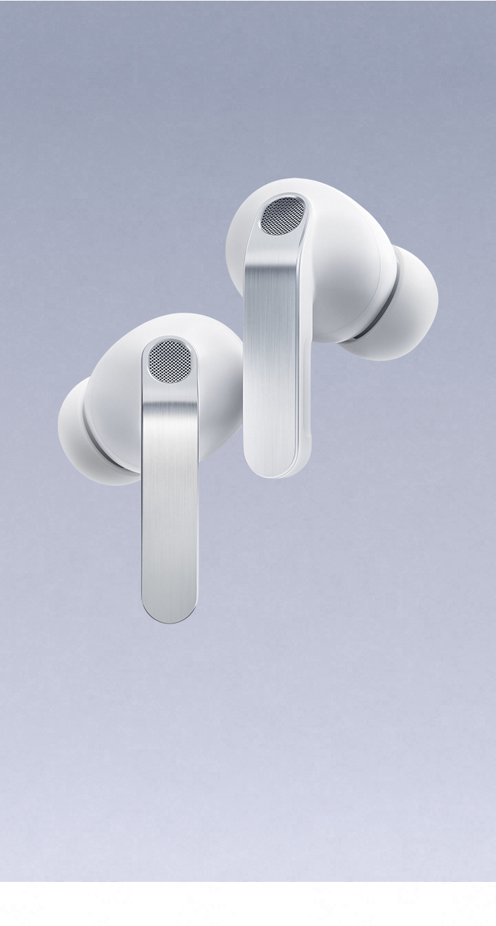 'A pair of white Galaxy Buds4 Pro hover with the left earbud slightly lower than the right.