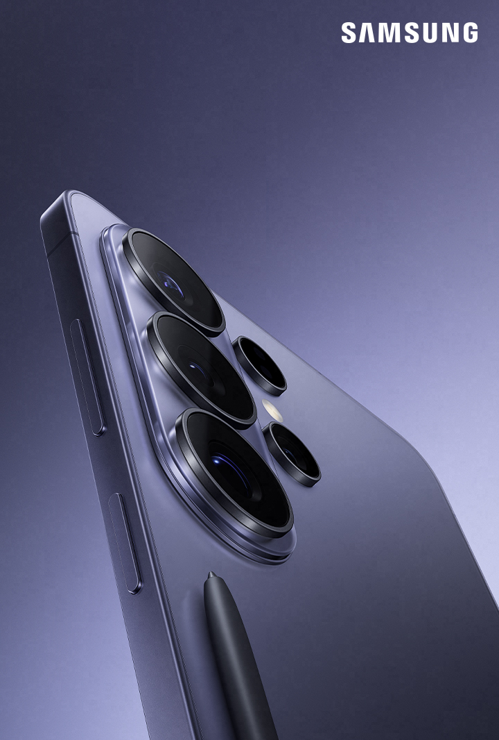 Close up of the corner of Galaxy S26 Ultra in Cobalt Violet showing camera lenses is seen. S Pen is seen in front of the device. Galaxy AI. Samsung.