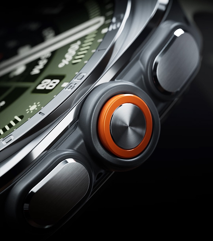 Close-up view of the boldly designed, intuitive buttons and the orange Quick Button on the side of a Galaxy Watch Ultra2 in Titanium Silver with a Marine Band in Olive, shown at an angle.