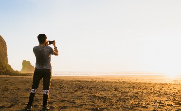 man-phone-photo-beach-tile.jpg