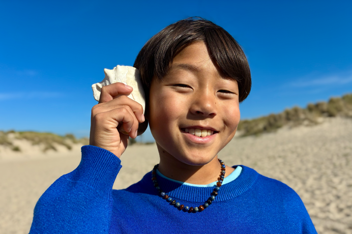 Photo taken with 48MP Fusion camera, next-generation portraits feature in use, focused on a person’s face