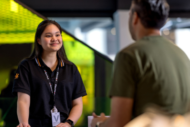 Staff member assists a customer