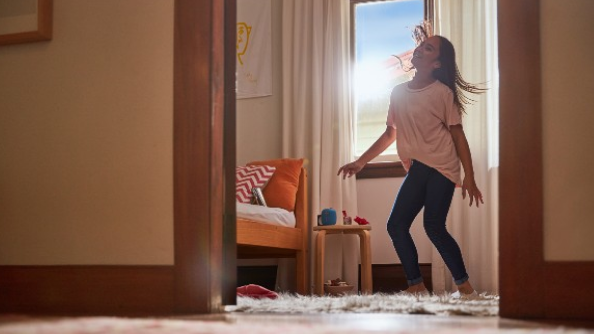 Girl dancing with headphones on
